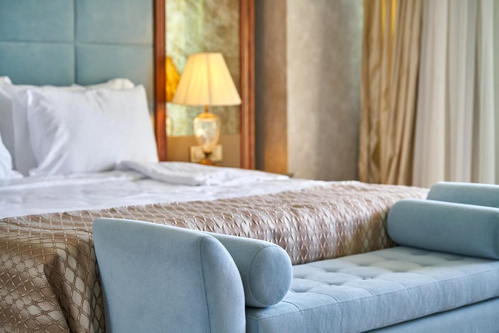 Comfortable hotel room with a city view through large window